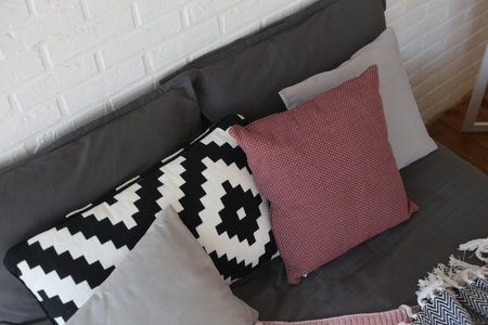 interior bedroom with details on the bed and textiles gray pink style