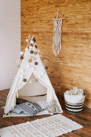interior of bedroom with bed in boho style decor