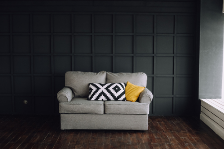 interior of rooms with a gray sofa on a black backgroundの写真素材