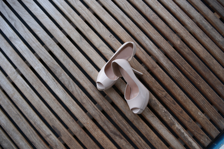 female shoes with beige heel on texture backgroundの写真素材