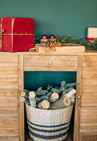 Rustic room decoration for Christmas parties with gift boxes and pine needles green brown beigeの写真素材