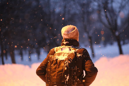 man alone outside in warm clothes winter snow frost joy
