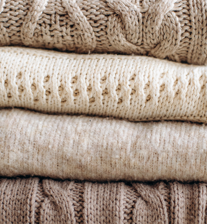 textiles various plaids knitted with patterns are in a stackの写真素材