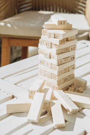 board game with wooden paneled numbers figures balance constructionの写真素材