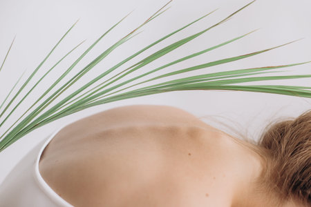 back health woman body ridge texture with palm leaves