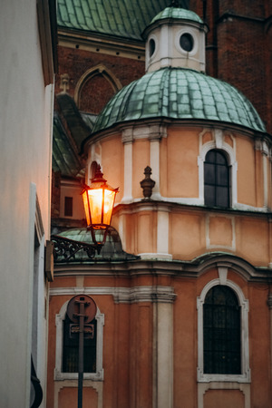 night street in the old town architecture of the building with lanterns and lampsの写真素材