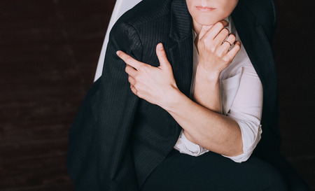 woman in business suit and shirt posing in the studioの写真素材
