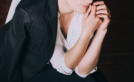 woman in business suit and shirt posing in the studioの写真素材