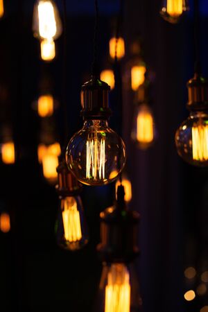Edison lamps decorative group in a garland suspended on wiresの写真素材