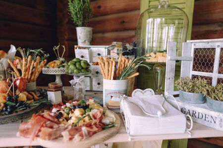 food buffet reception snacks cheese card honey and fruit meat ham varietyの写真素材