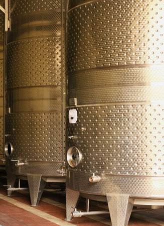 stainless steel tank barrels in a wine production workshop