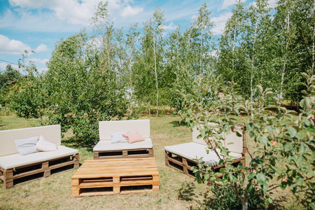 loft lounge area wooden sofas and activity table for garden activities