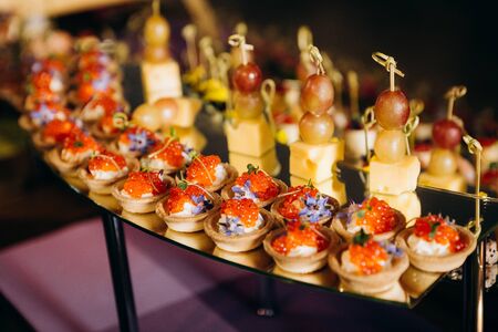 variety of food snacks sandwiches a lot on the table a festive partyの写真素材