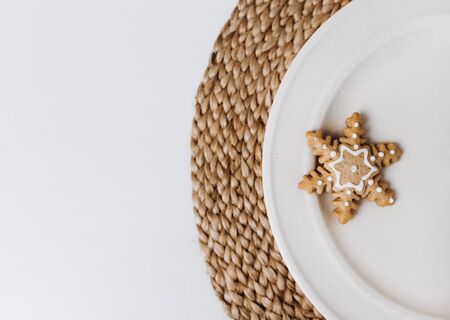 snowflake christmas gingerbread cookie winter symbol on plate inside house familyの写真素材