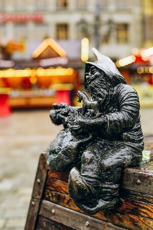gnome figurine with toy horse outside christmas garland symbol wroclaw polandの写真素材