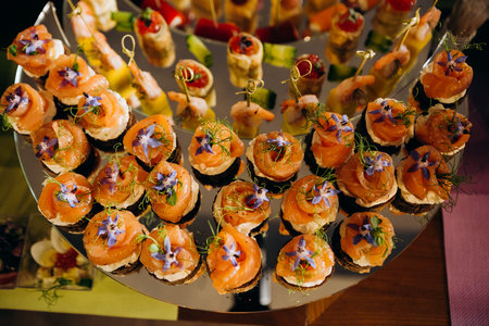 appetizer set of seafood cupcake and cheese with grapes on a mirror stand