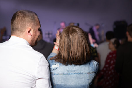 concert scene fan hands spotlight illuminated club nightlife showの写真素材