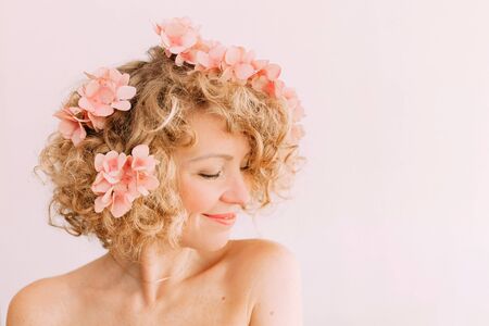 woman holiday flowers wreath pink laugh happiness face make upの写真素材