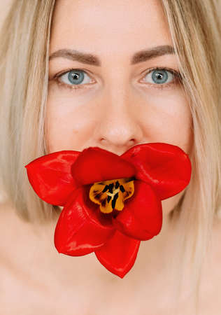 womens holiday red tulip and a girl with bright lipstickの写真素材