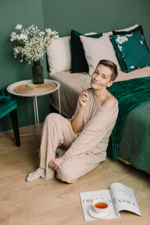woman in pajamas spring concept home interior green style parisの写真素材