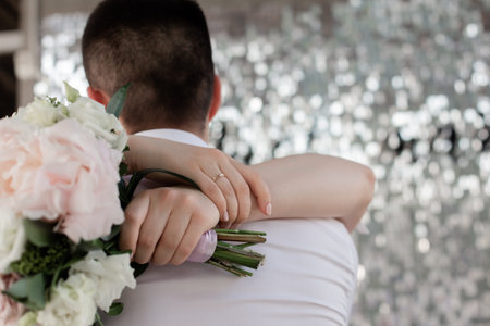 young couple lovers hug hands event wedding flowers rings
