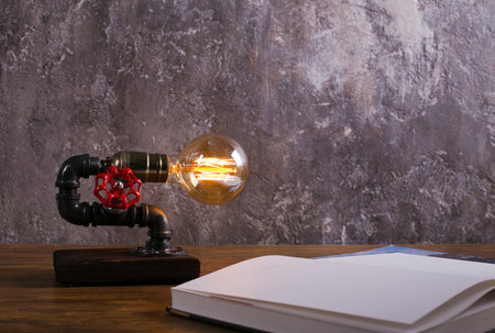 metal lamp night light in a loft style with a retro lamp in the interior of the apartment