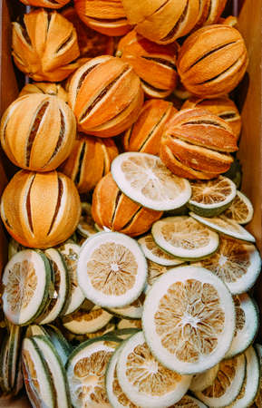 christmas decoration dried peel lemon orange slices background filled bright holiday cardの写真素材