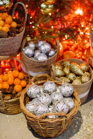 christmas symbol decorations for the festive tree items balls cones nuts shiny in baskets rusticの写真素材