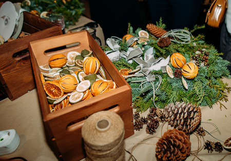 christmas wreath making process tools and decorations and detailsの写真素材