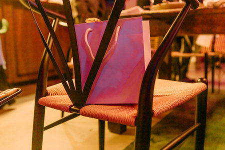 craft package gift holiday under the christmas tree with garlandsの写真素材