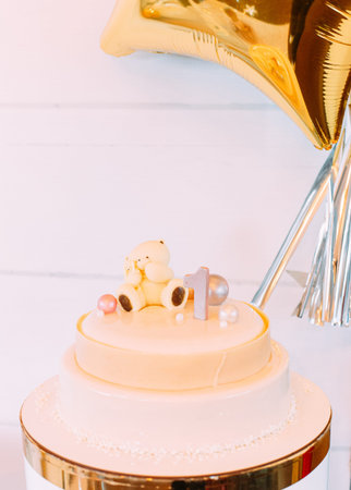 festive cake for the event first year celebration party with decor elements