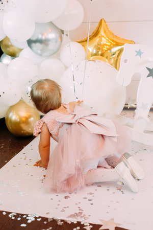 funny little girl celebrate first year old pranks and playの写真素材