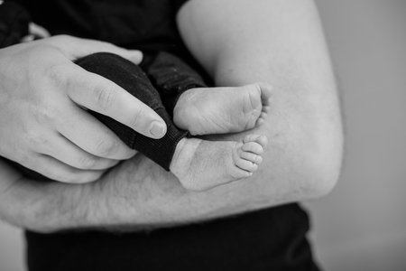 mother and newborn baby in her arms birth new life humanity light religion