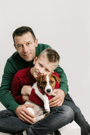family together with pet jack russell christmas cardの写真素材