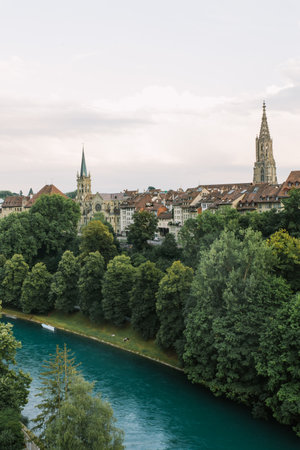 old town of switzerland against the backdrop of mountains and spring vegetationの写真素材
