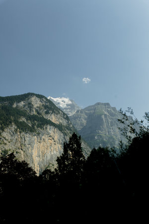 mountains and green meadows of switzerland reserve and ecology natureの写真素材