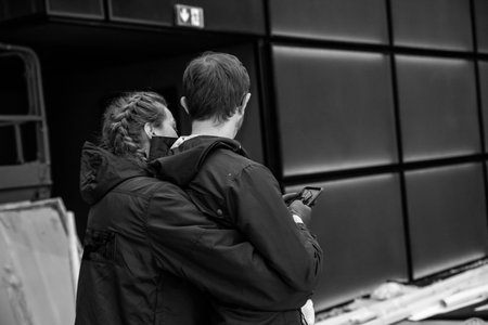 couple in love hugging happy family together standing backwardsの写真素材