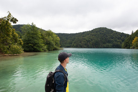 tourist people mountain river waterfall turquoise clear water nature ecologyの写真素材