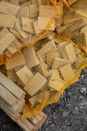firewood harvested in nets in a warehouse for sale wood ecology natural