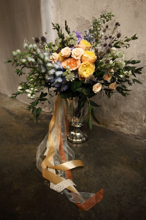 bouquet with ribbons on the old floorの写真素材