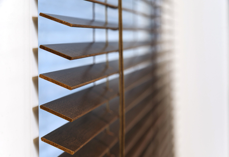 Wooden shutters on the window in the living room.の写真素材