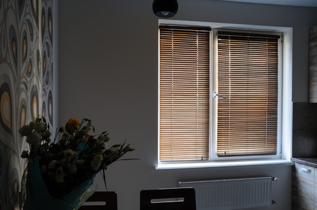 Interior room with wooden shutters on the window.の写真素材