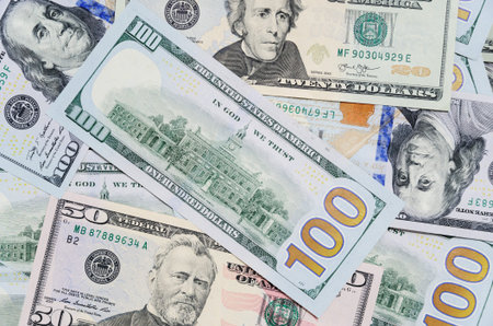 Banknotes 100 US dollars and 50 are randomly arranged.