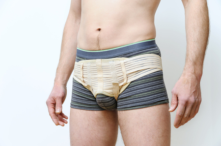 Prevention inguinal hernia. A man is girded with a hernia belt.の写真素材