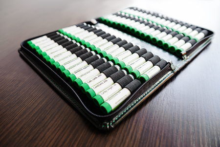 Containers with homeopathic balls in homeopathic wallet setのeditorial素材