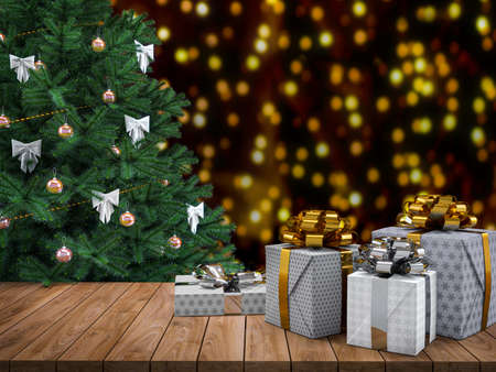 Wooden table top with gift boxes and Christmas tree.の写真素材