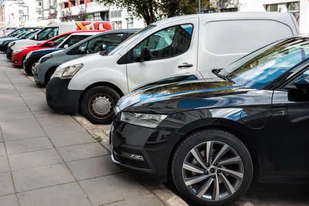 Various cars are parked along the road.の写真素材
