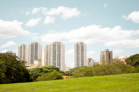 City ââbuildings with sunny sky in the parkの写真素材
