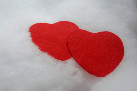 Red heart and white snow, Two red hearts Card.の写真素材