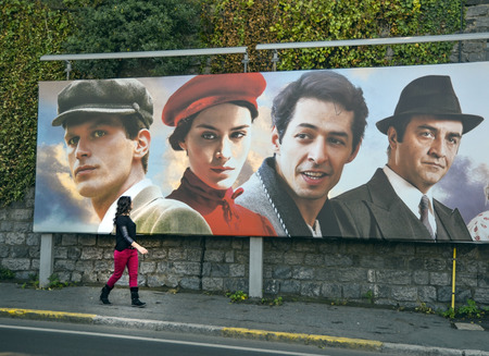 Istanbul, Turkey - October 20, 2013: Turkish film "The Butterfly's Dream" movie posters and street people showing interest. The Butterfly's Dream, poetic life subjects, written and directed by Yilmaz Erdogan made the 2013 drama.のeditorial素材